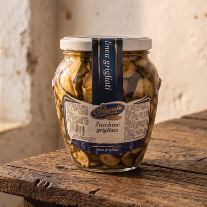 Zucchine a rondelle grigliate e messe sott'olio con aglio e prezzemolo. Nota affumicata dalla griglia. bottega verdure grigliate salento